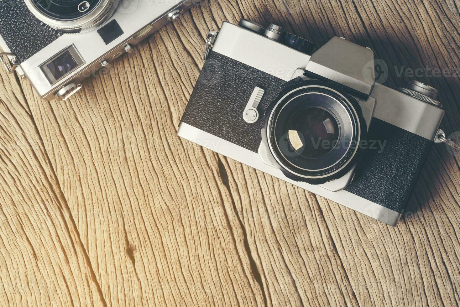 vintage old film camera on wood board photo