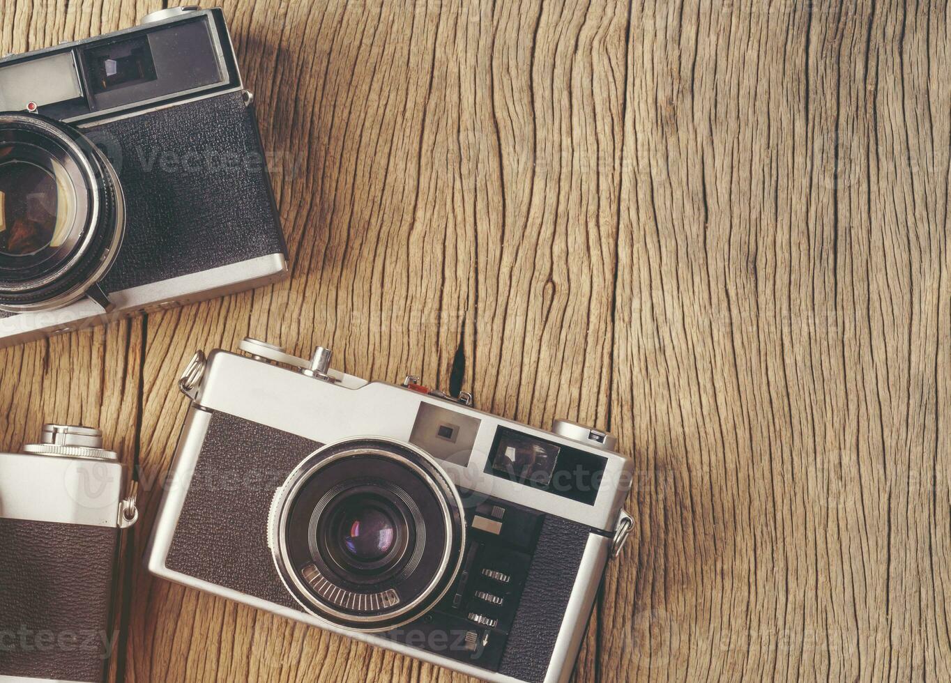 vintage old film camera on wood board photo