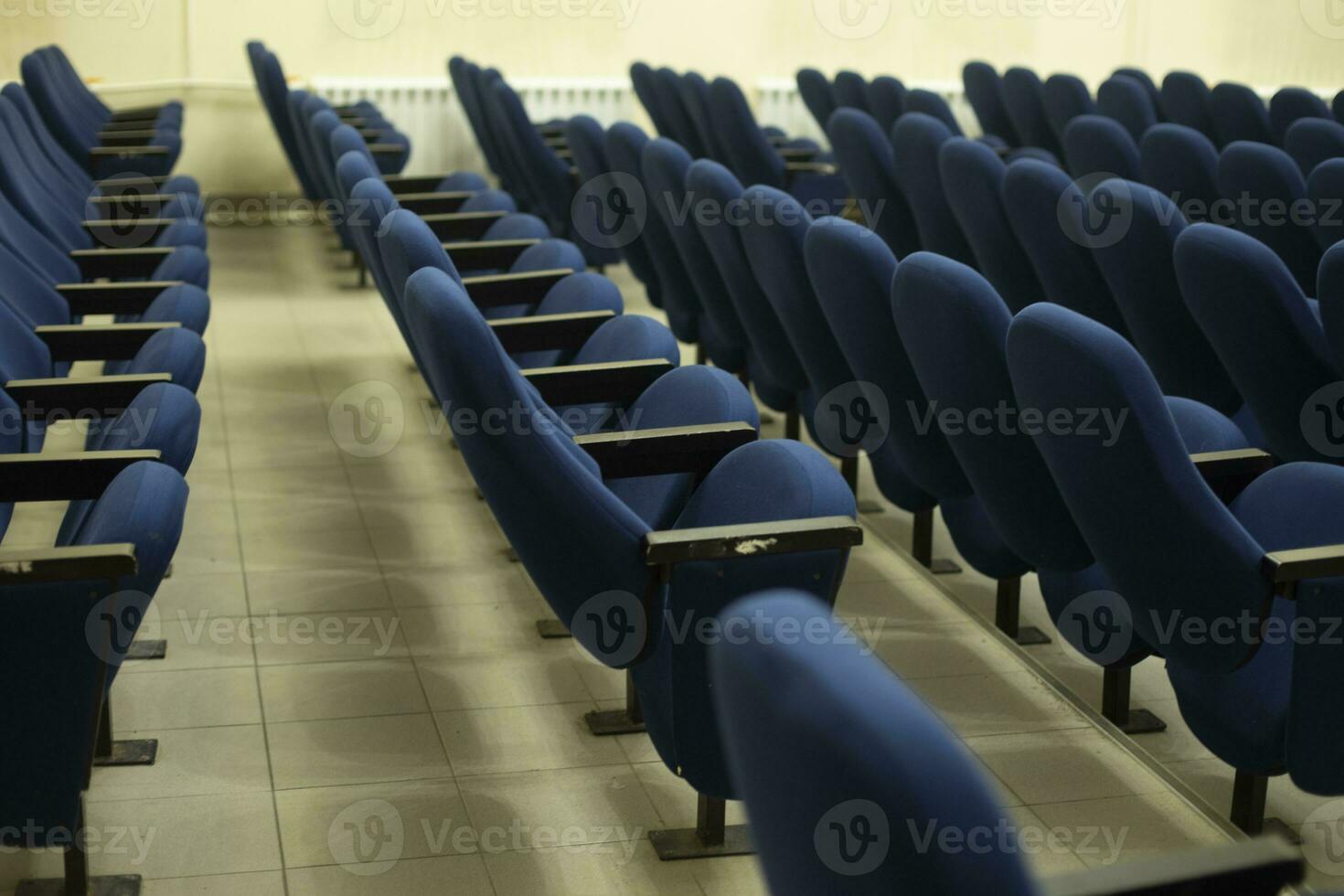 Blue seats in hall. Chairs in cinema. Place to watch movie. photo