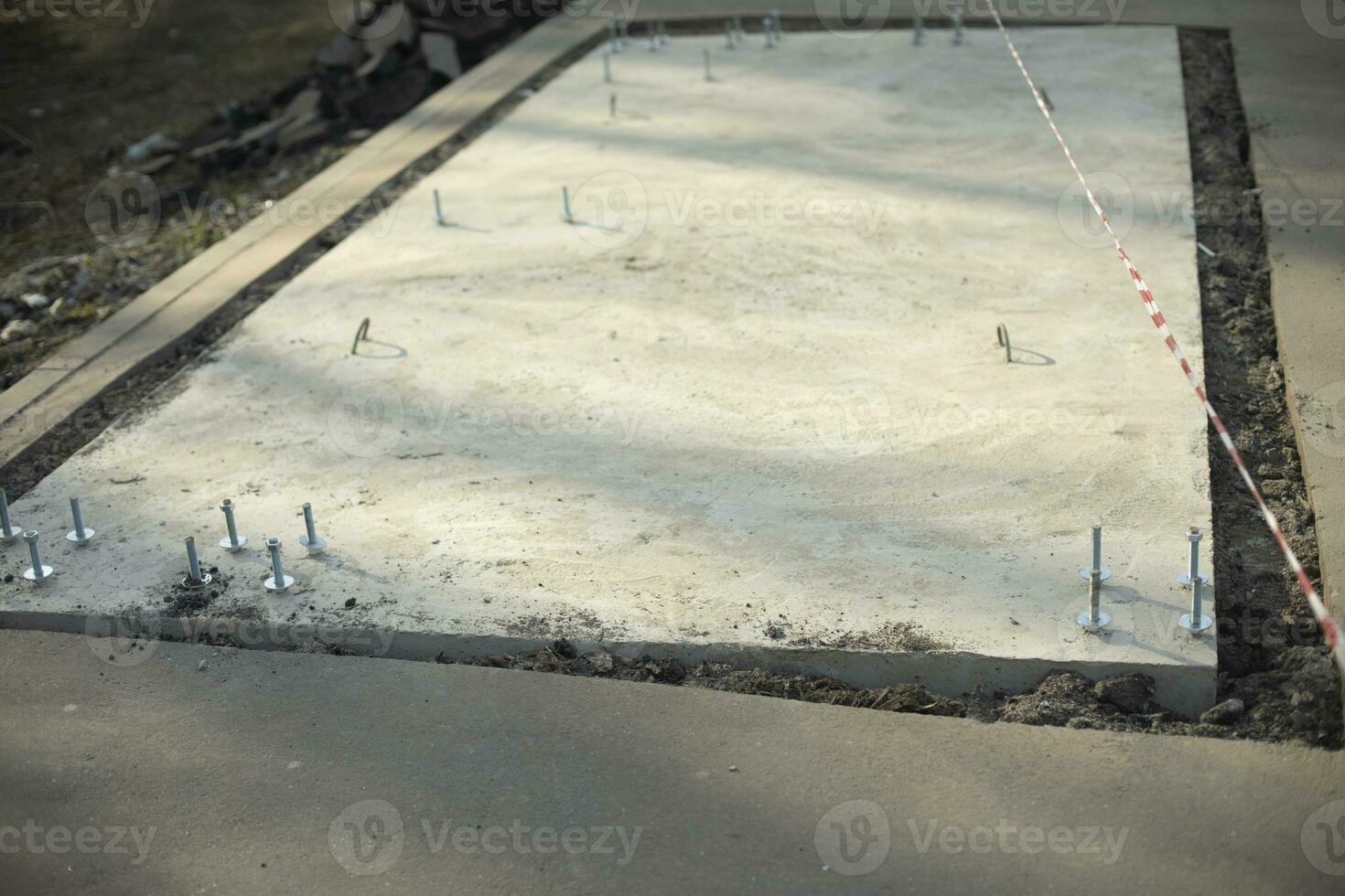 Foundation for installation of structure. Base of building. Construction of bus stop. photo