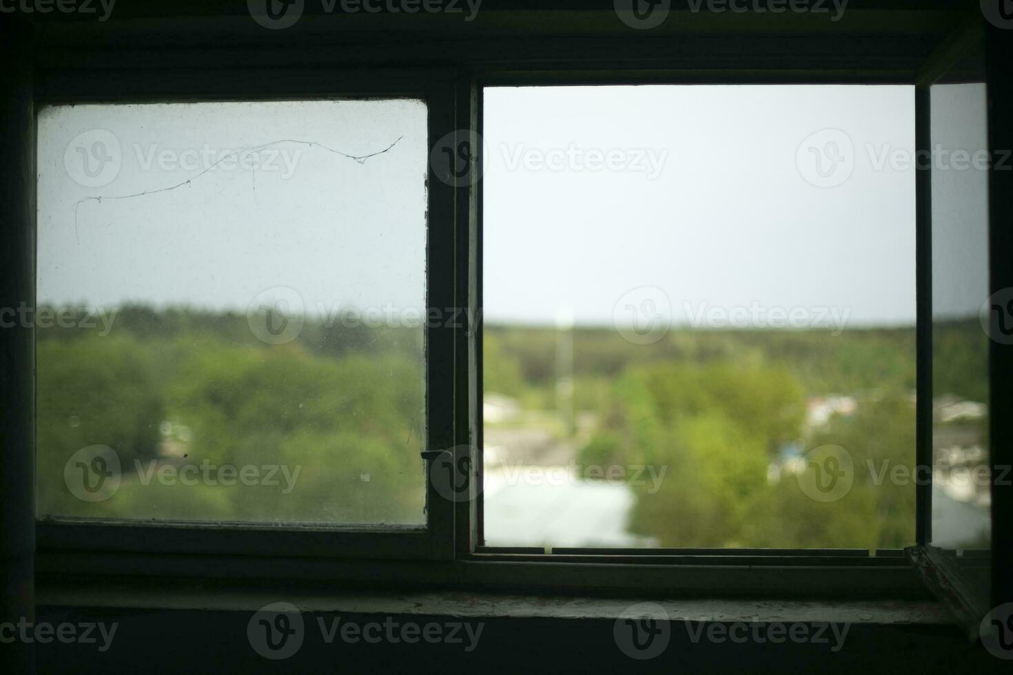 View from window on street. Dark room. Clear glass. photo