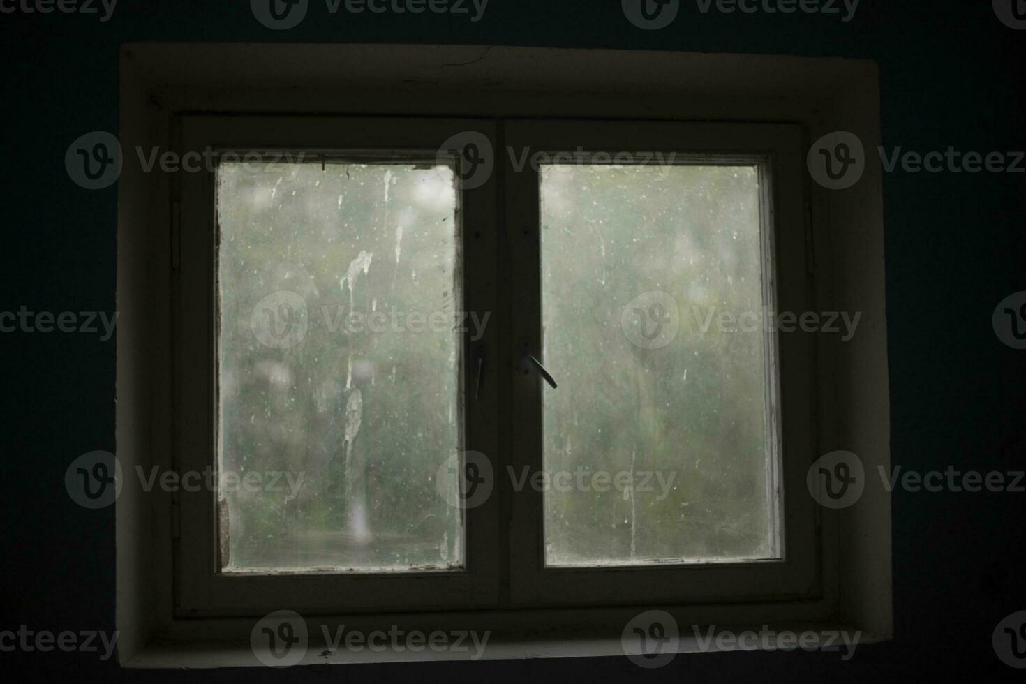 Window in building. Interior details. Window in dark room. photo