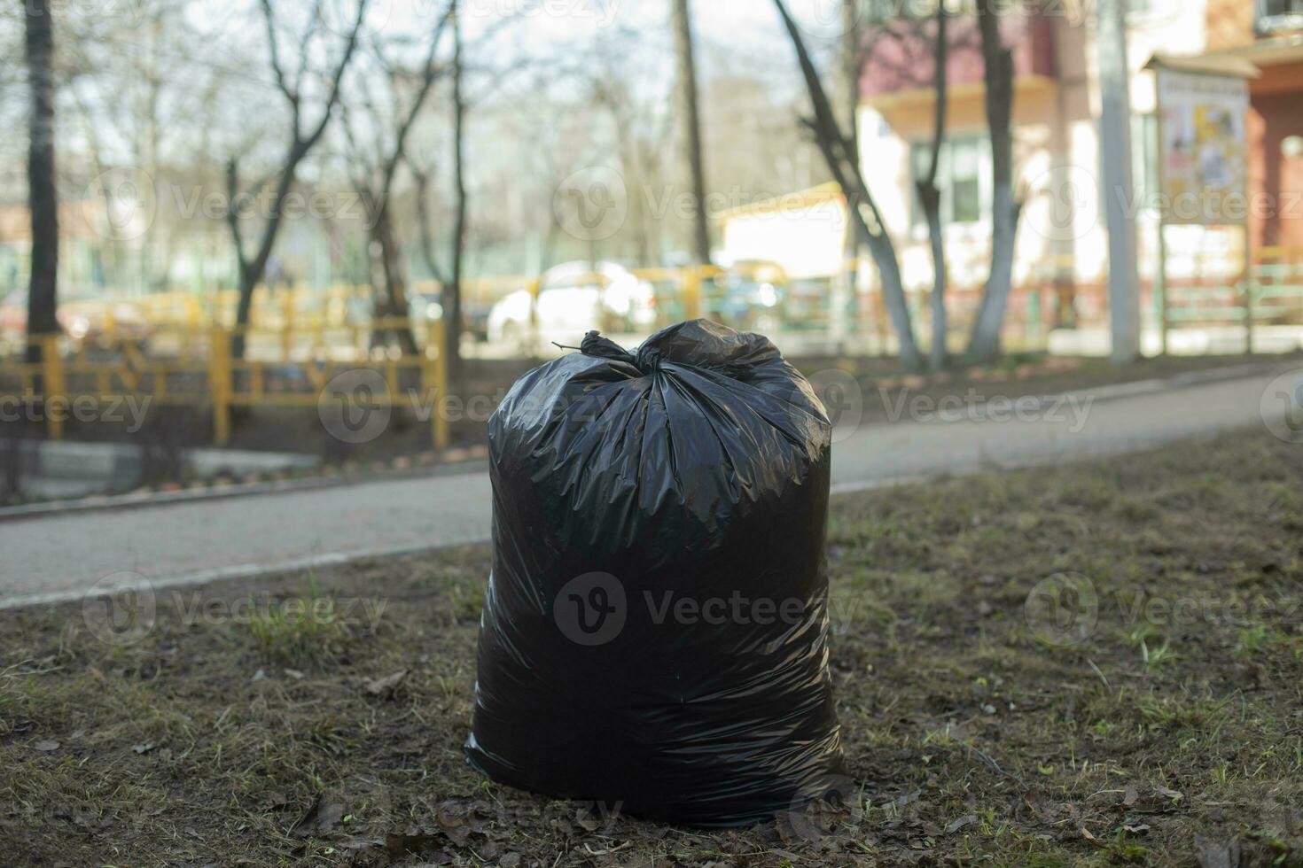 Garbage bag. Black Waste Bag. Plastic bag. photo