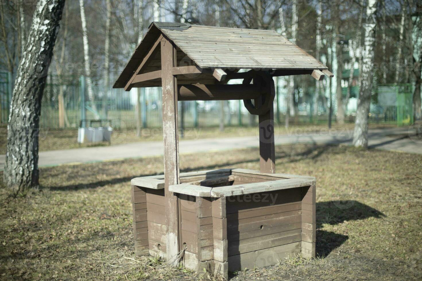 Old well. Wooden structure. Details of countryside. photo