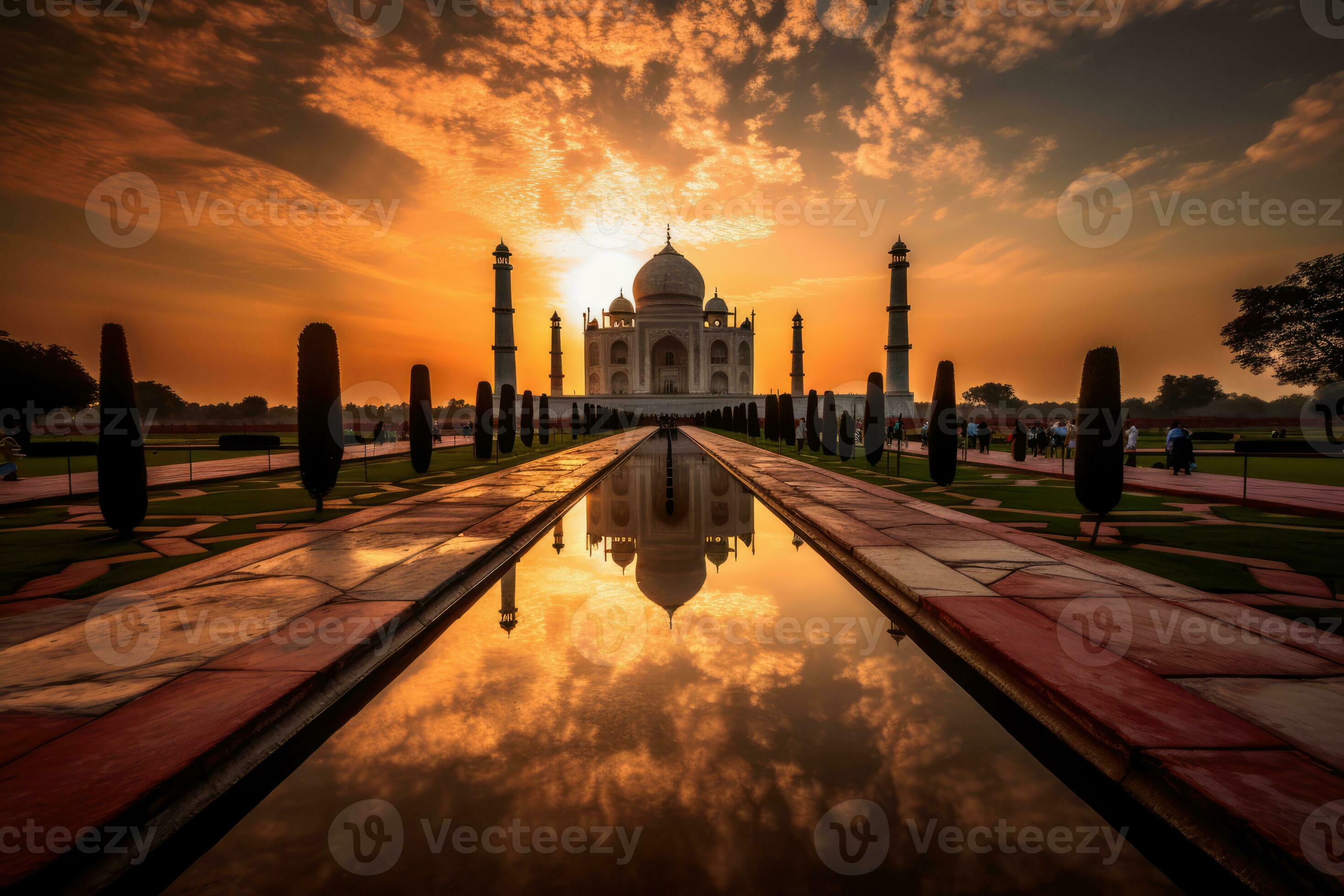 the iconic Taj Mahal monument at sunset, with the sun's warm hues