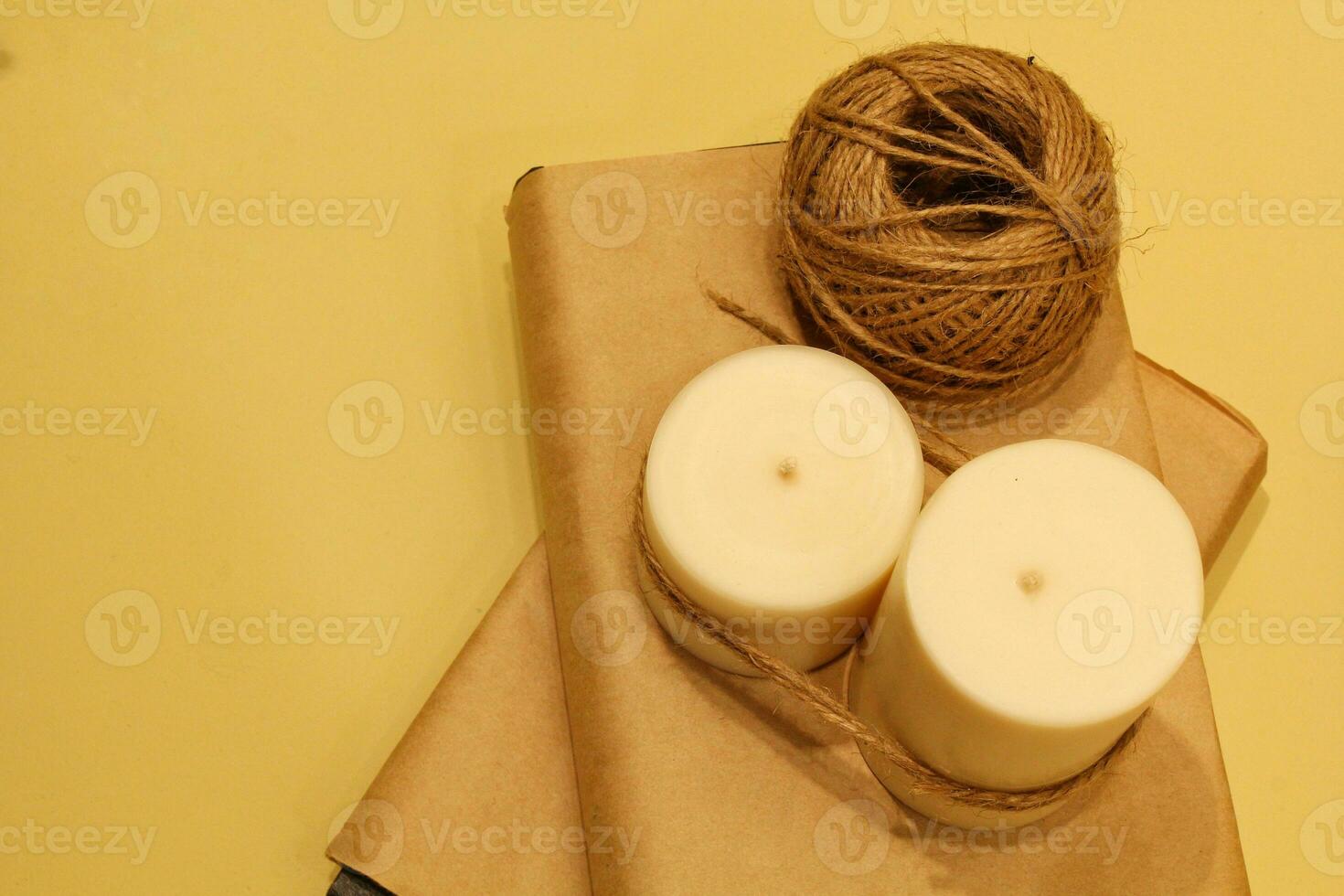 Decorative wax candles, craft paper and thin jute twine for needlework.  Women's hobby. Handicraft. DIY accessories for making candles. Eco friendly  and natural materials 26684905 Stock Photo at Vecteezy