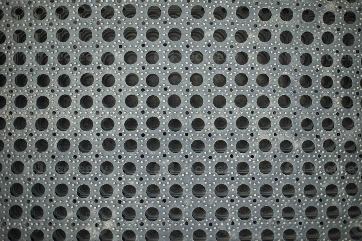 Rubber mat. Texture of machine mat. Surface for collecting dirt from boots. photo