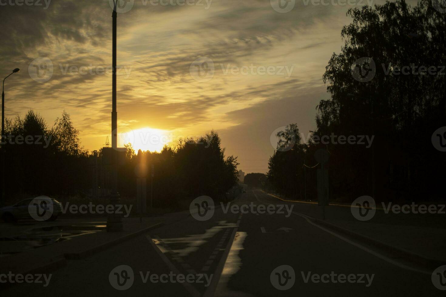 Road at sunset. Empty track. Evening on highway. photo