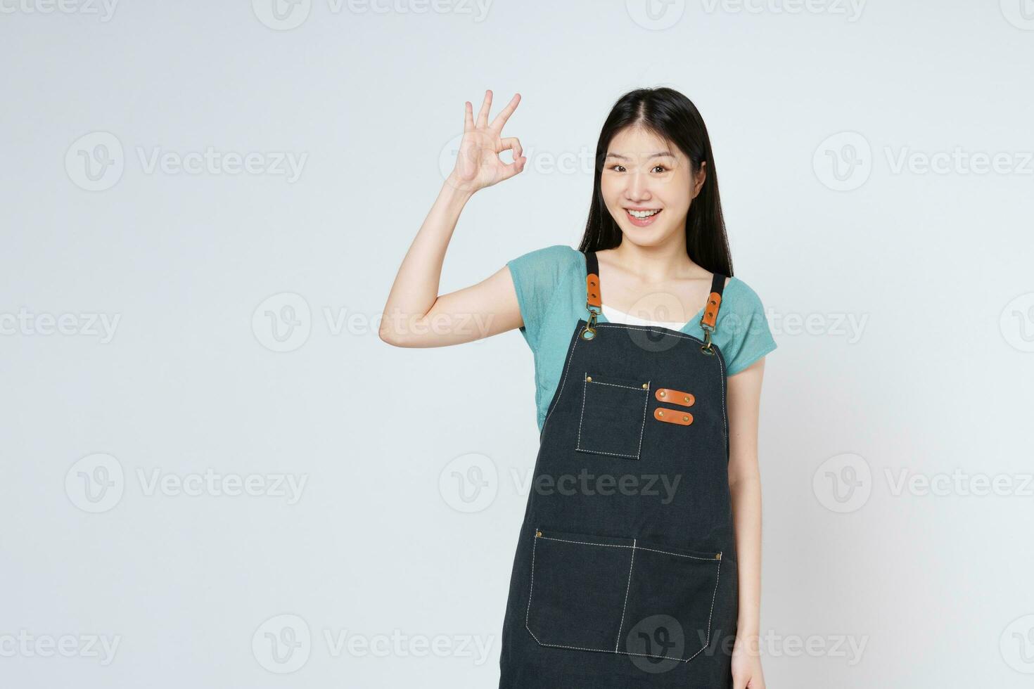 Restaurant owner sme woman showing OK sign isolated on white background. photo