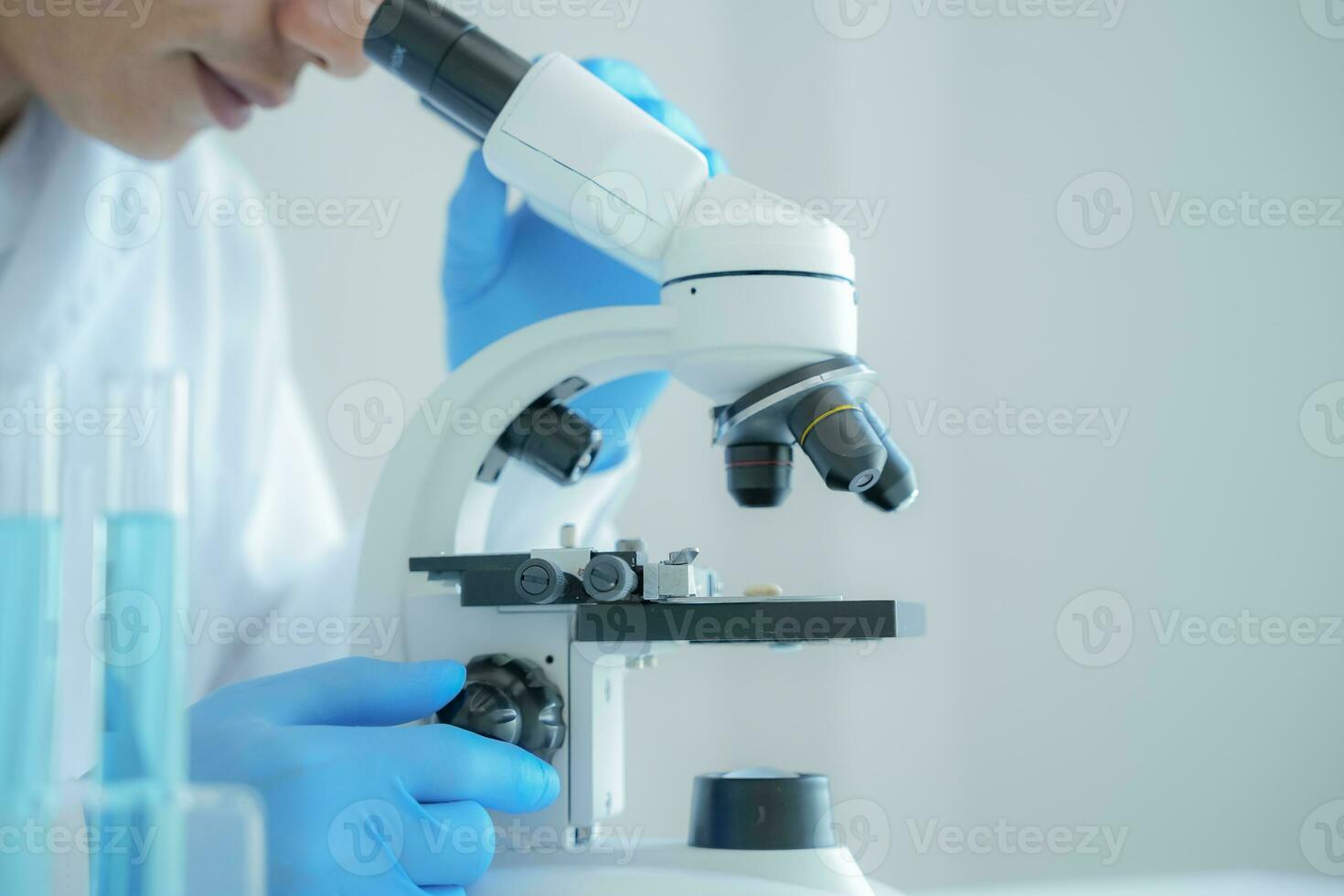 Scientist analyze biochemical samples in advanced scientific laboratory. Medical professional use microscope look microbiological developmental of viral. Biotechnology research in science lab. photo