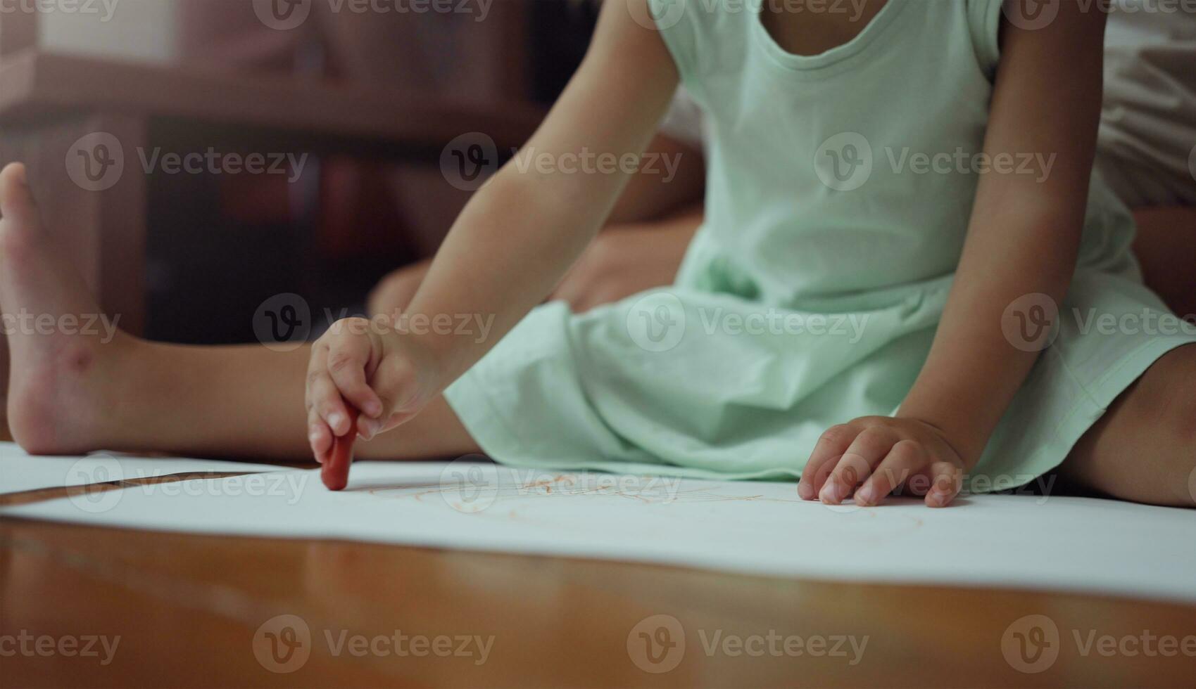 Girl kid drawing with crayons. photo