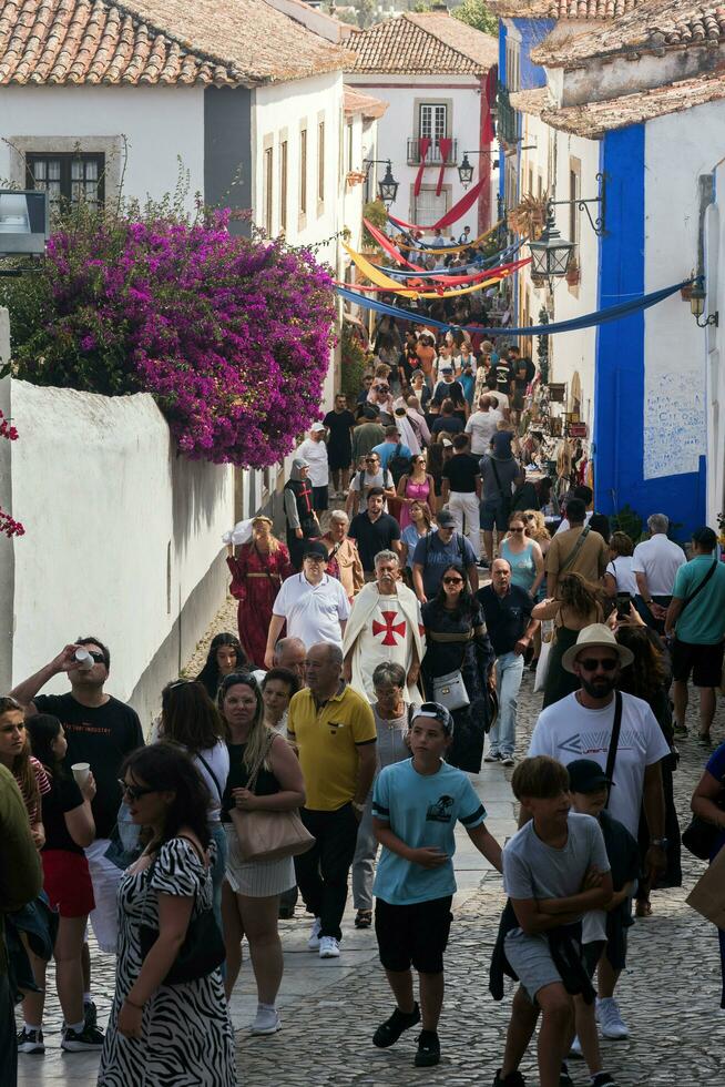 The Medieval Market of Obidos, Portugal is an event of historical animation filling it with colour, music, smells and period costumes of the Middle Ages photo