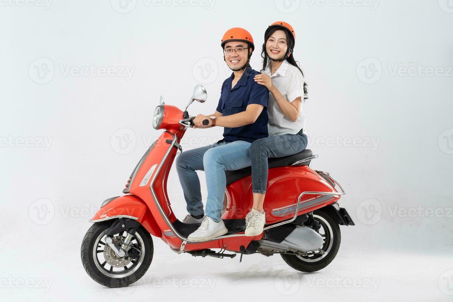 image of asian couple riding scooter on white background photo