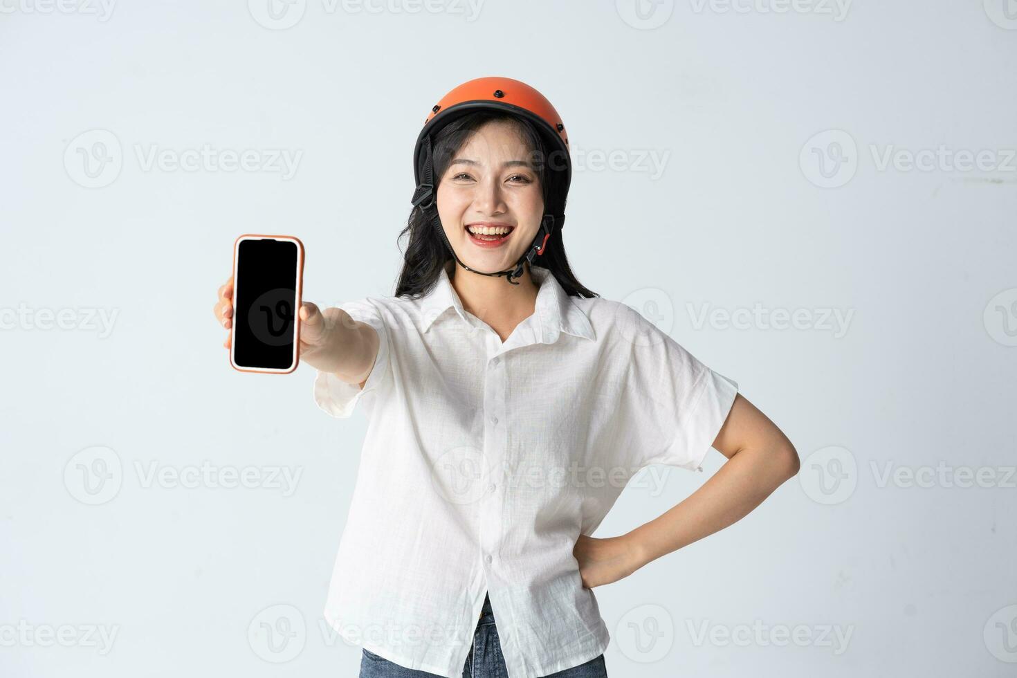 woman wearing orange helmet on white background photo