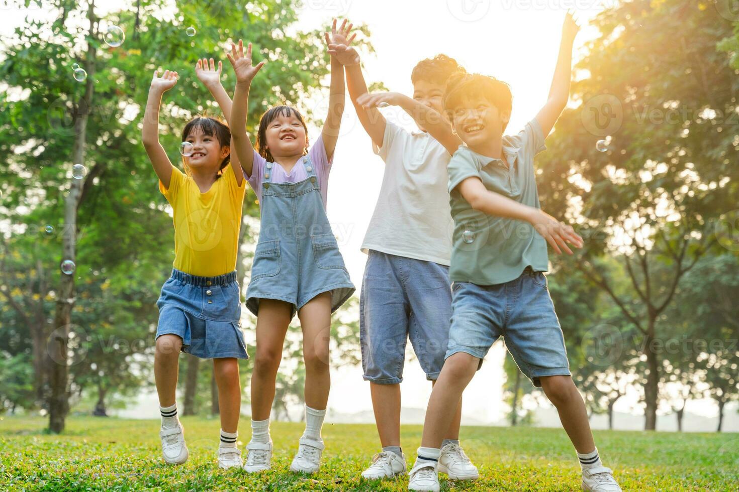 group image of cute asian children playing in the park photo