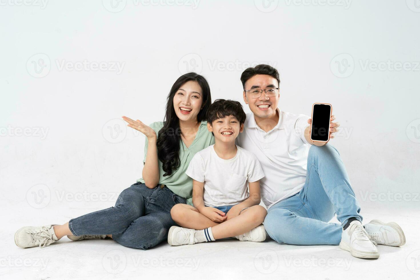 a family posing on a white background photo