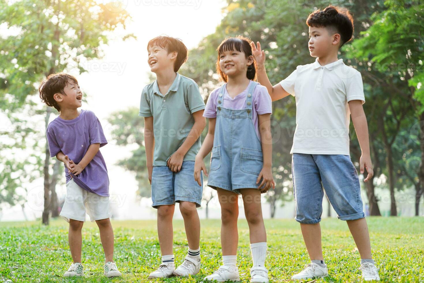group image of cute asian children playing in the park photo