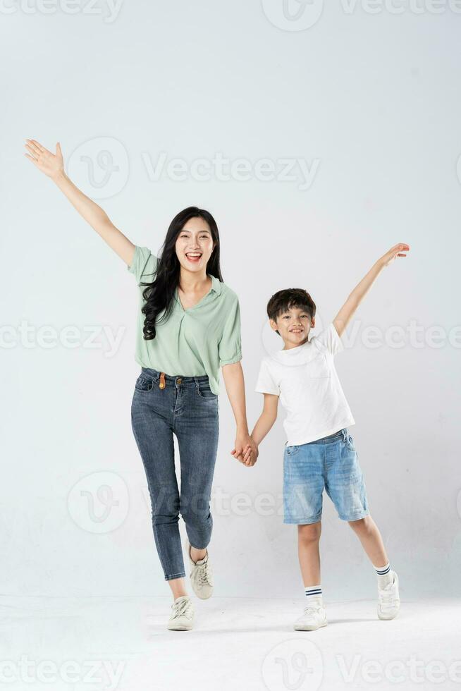 mother and son posing on a white background photo