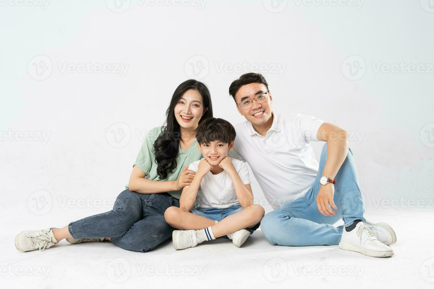 a family posing on a white background photo
