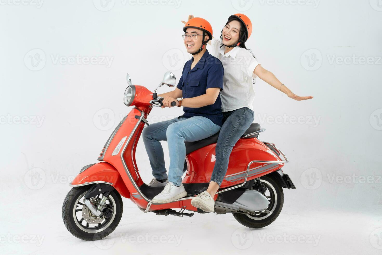 image of asian couple riding scooter on white background photo