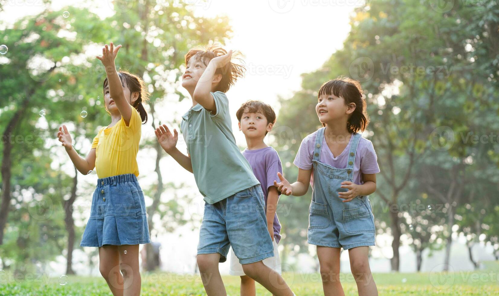 group image of cute asian children playing in the park photo