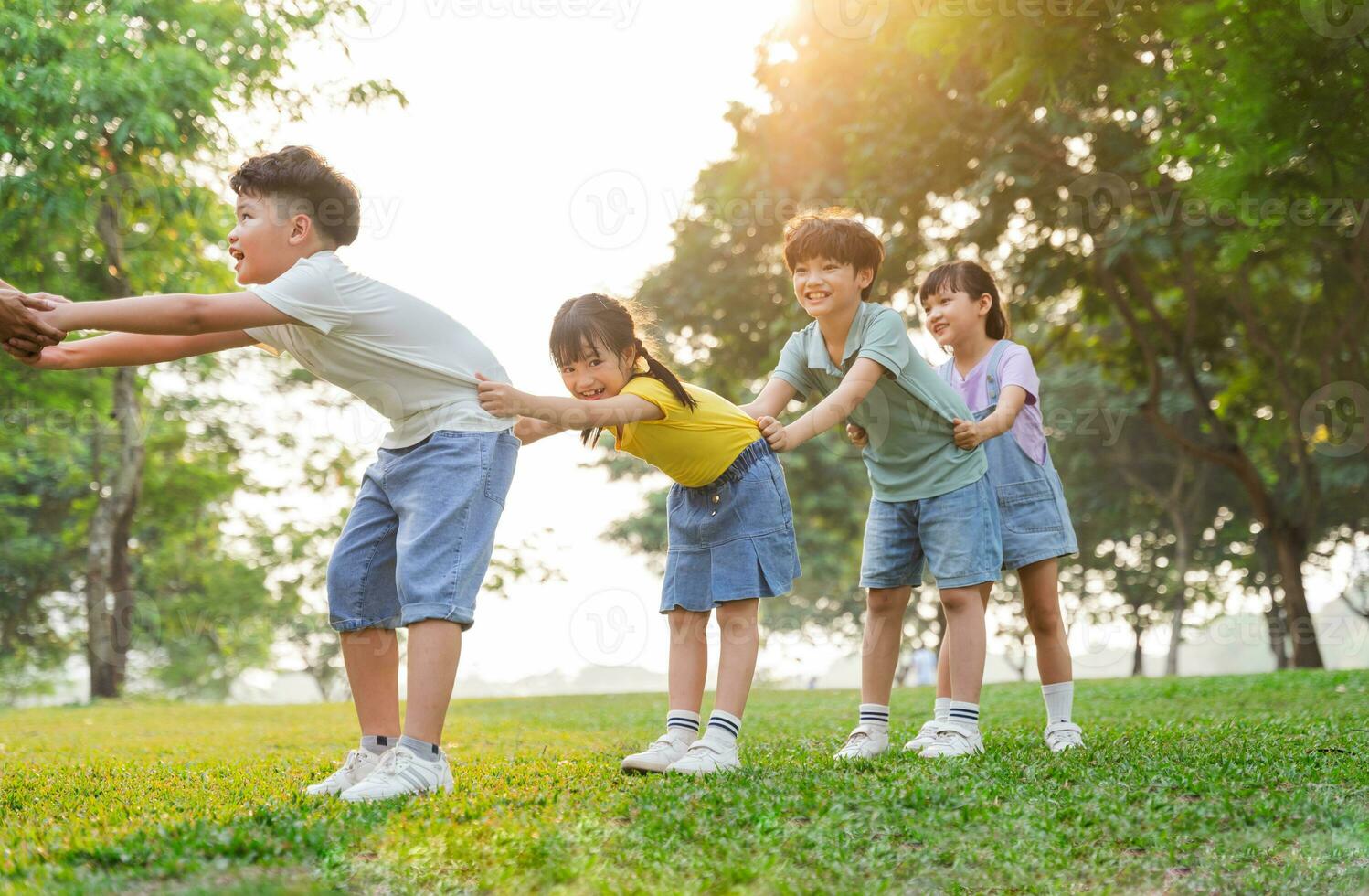 group image of cute asian children playing in the park photo