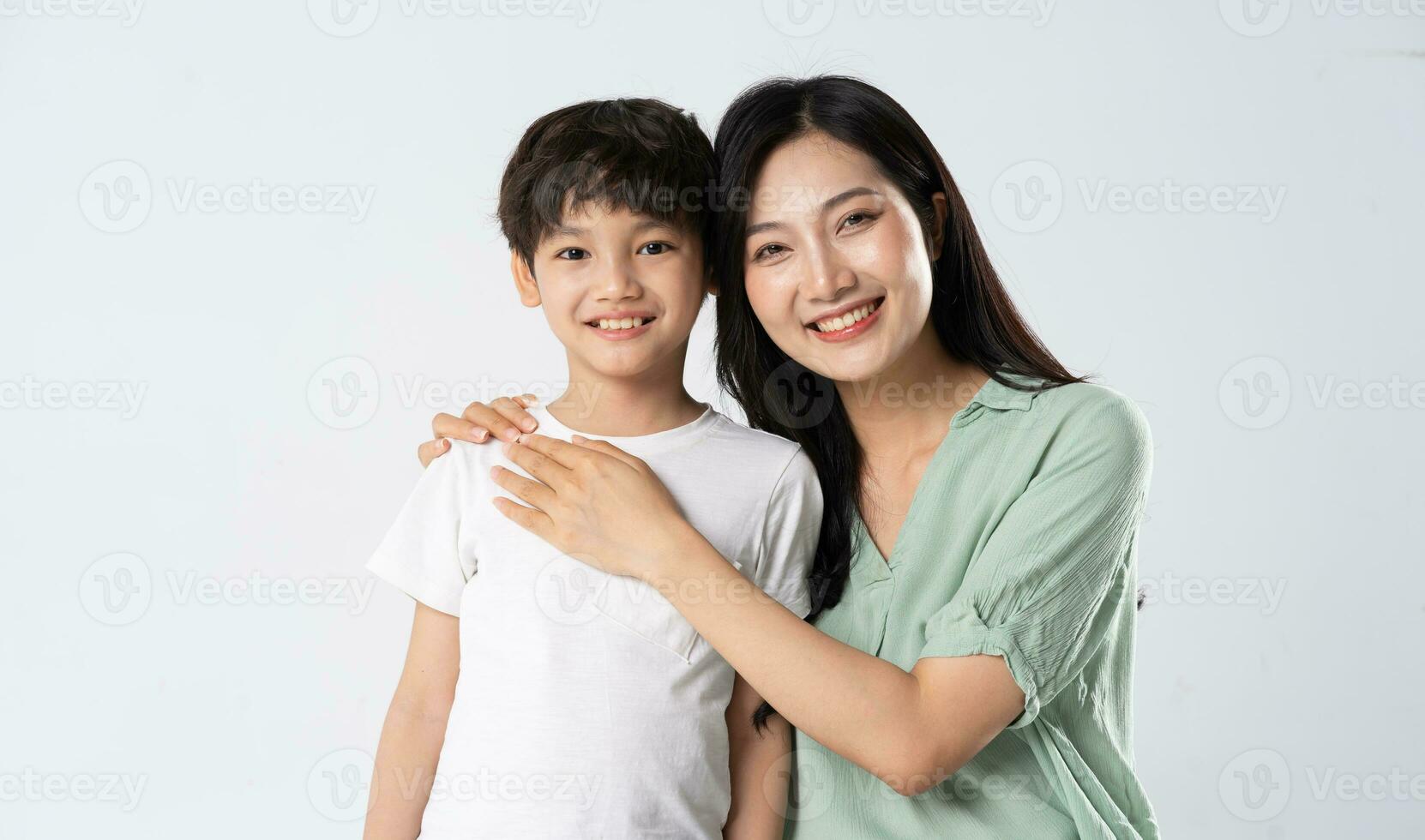 mother and son posing on a white background photo