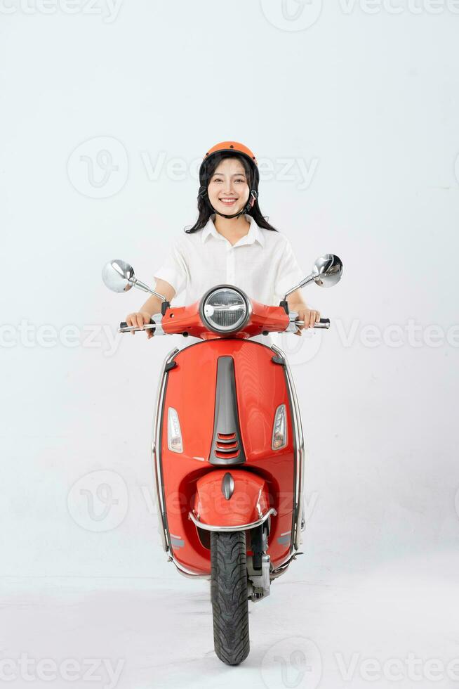 full body photo of a woman wearing a hairdresser and driving a motorbike