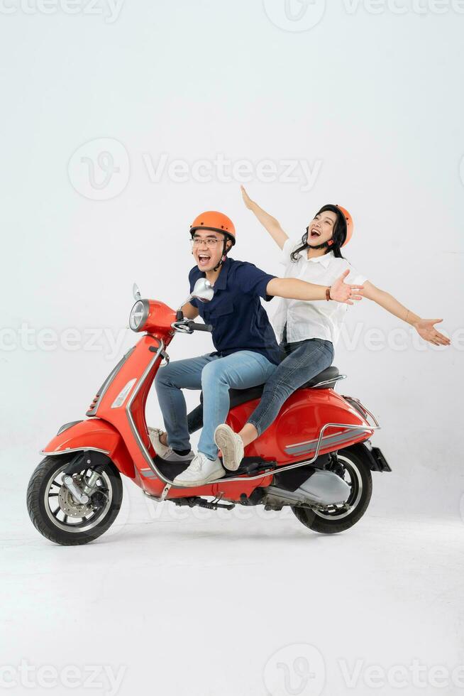 image of asian couple riding scooter on white background photo