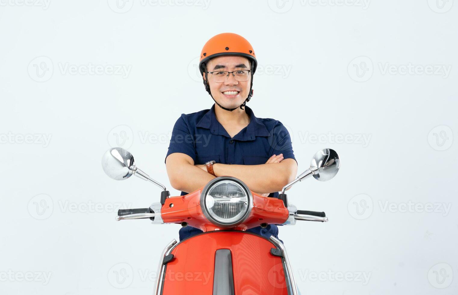 a man wearing a helmet and driving a motorcycle photo