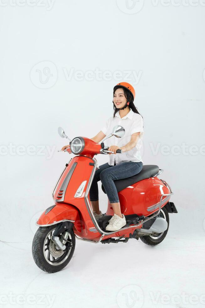 full body photo of a woman wearing a hairdresser and driving a motorbike