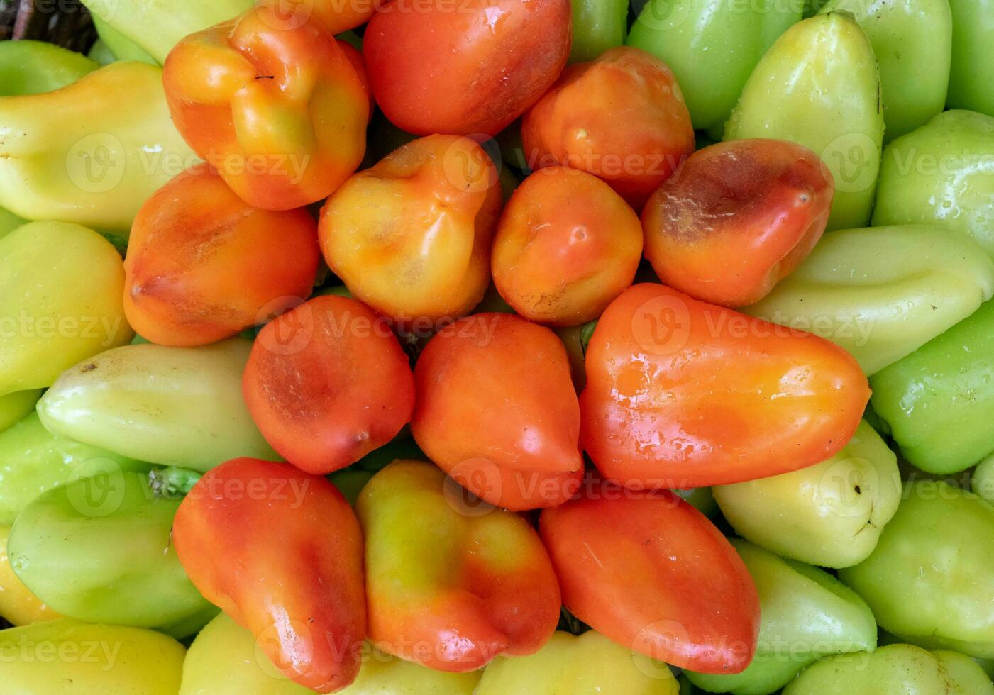 Bulgarian pepper is green and red in the basket photo