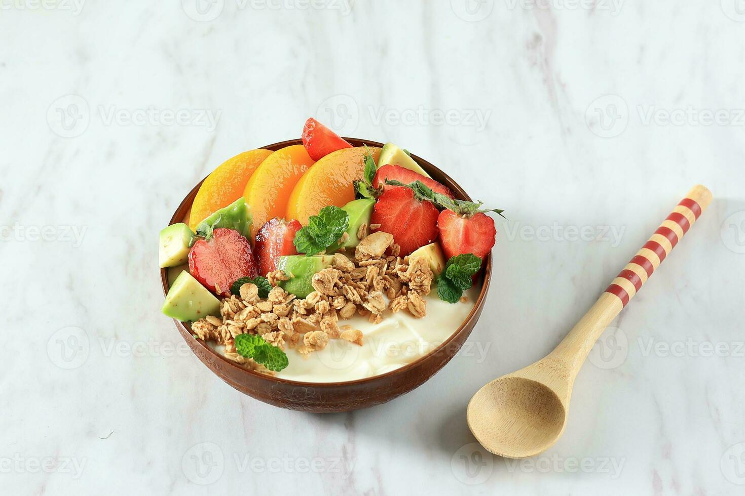 Healthy Fresh Strawberries with Yoghurt and Mint Leaves in Bowl on White Table photo