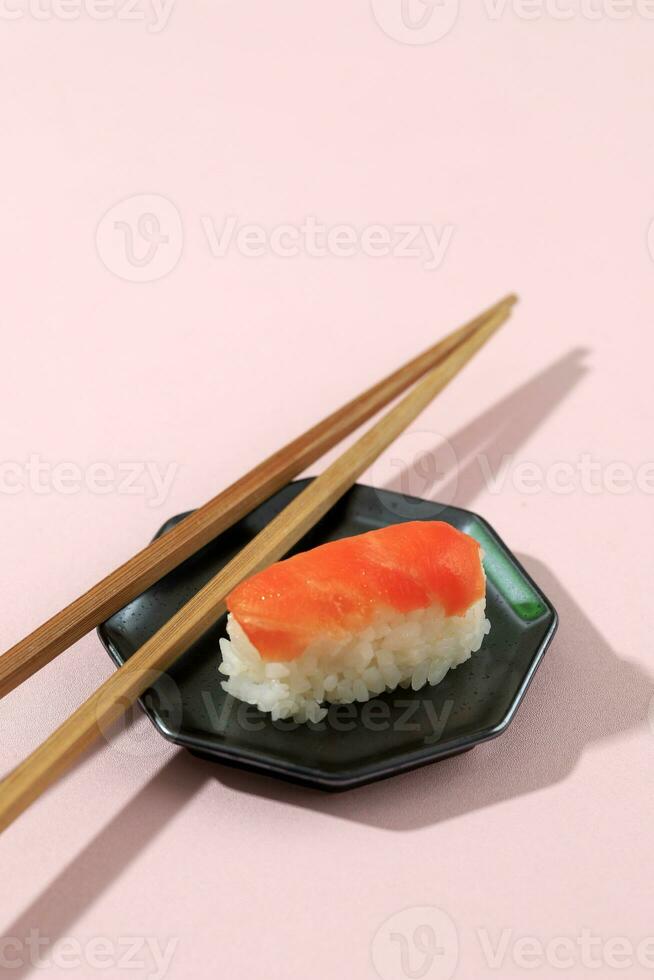 Nigiri Salmon Sushi on Pink Table photo