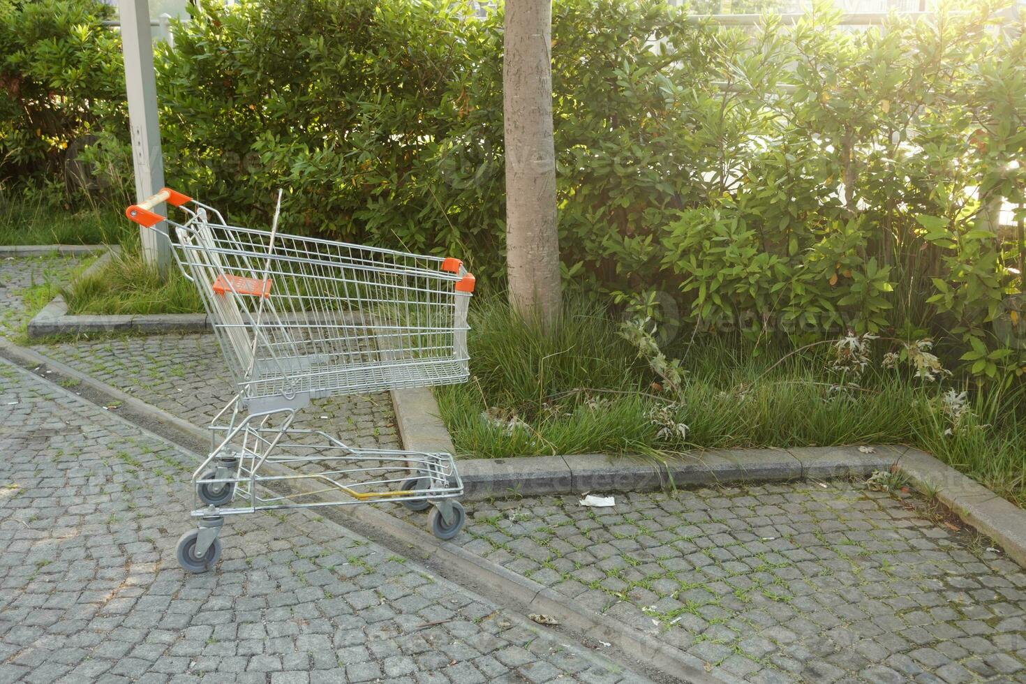 Shopping cart in a empty car park photo