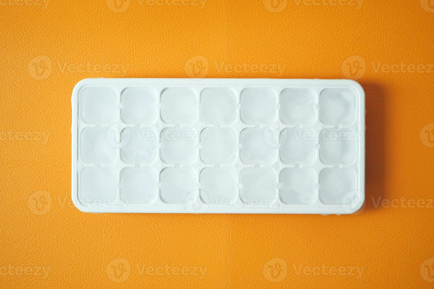 close up of many ice cubes on white background photo