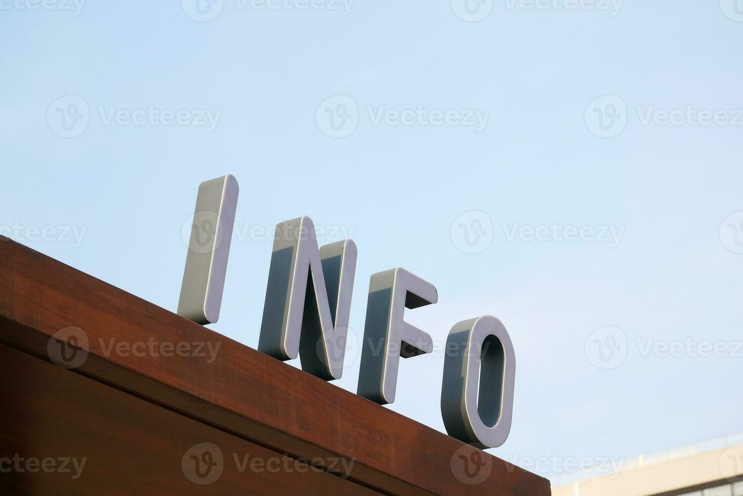 information sign on a buildings against blue sky photo