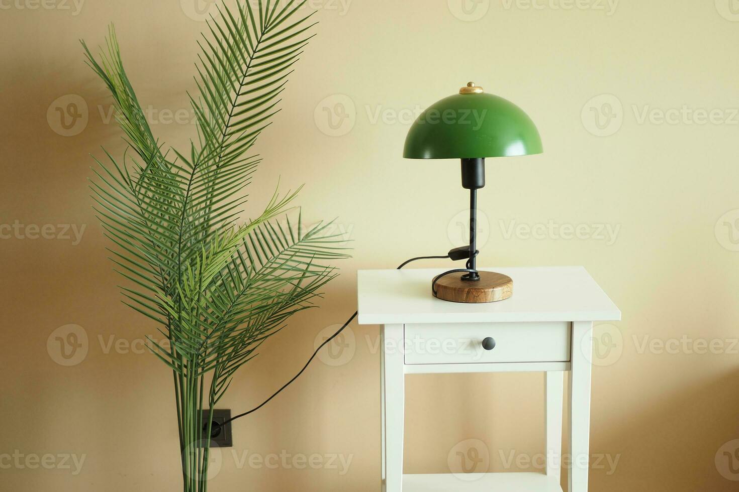 a table lamp in home against orange color wall photo