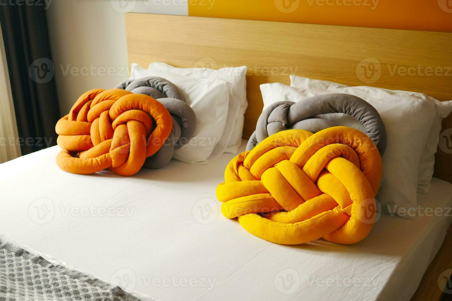 colorful pillow on white bed photo
