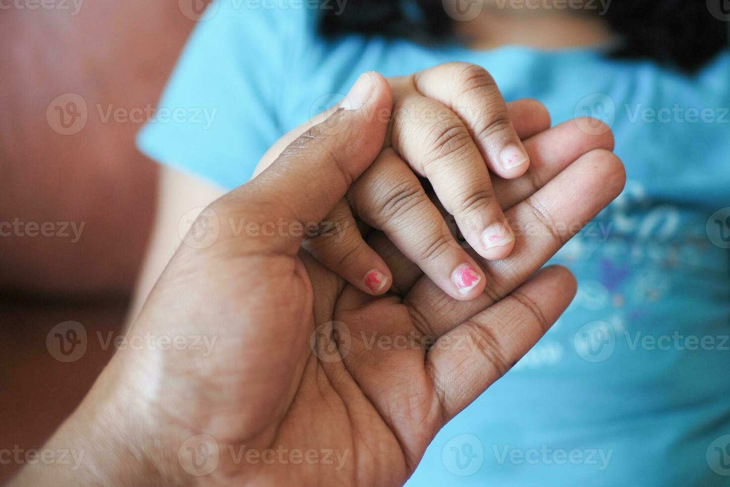 father holding hand of baby child, close up . photo