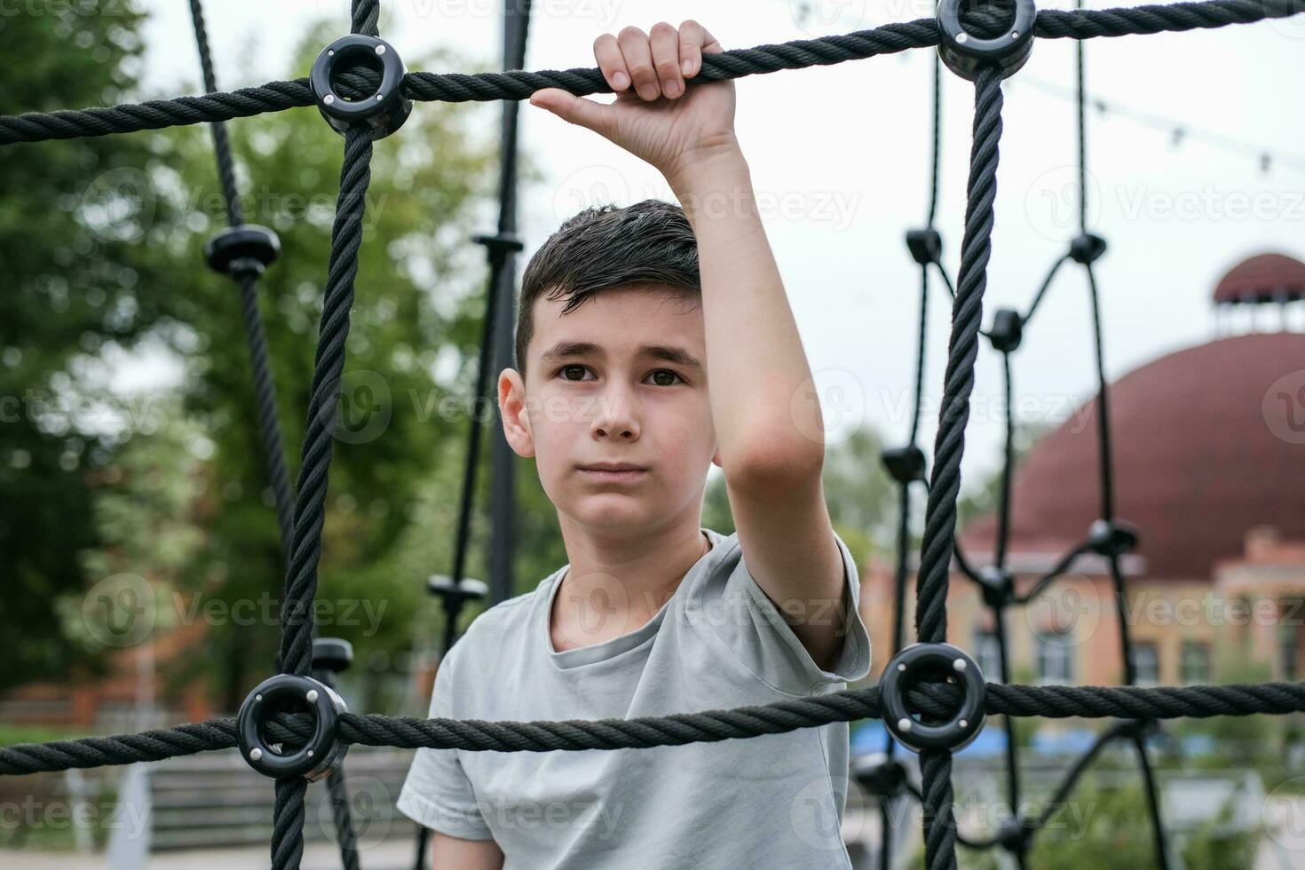 Portrait of a boy playing on the playground photo