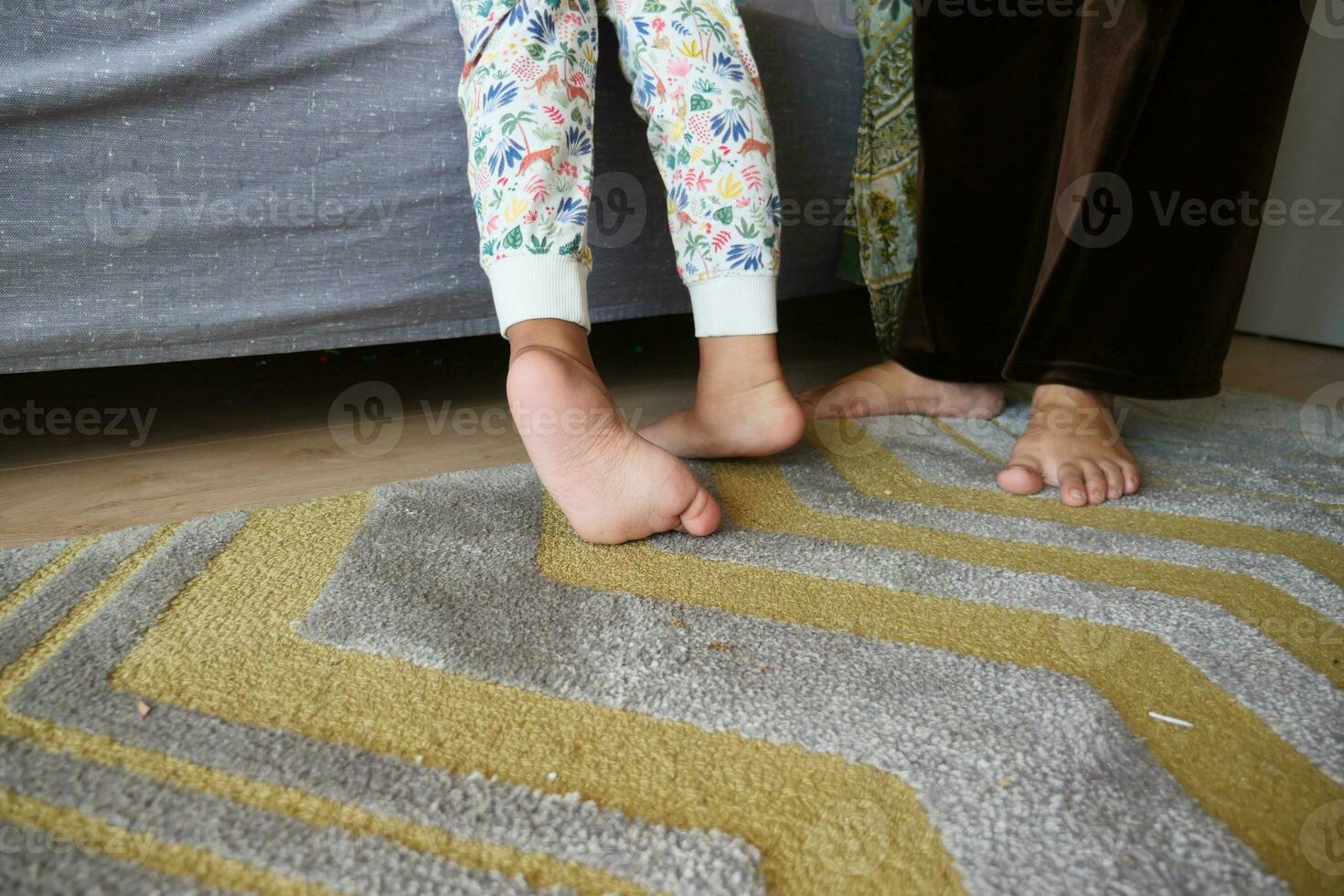 low angle view of A child walking on tiptoes photo