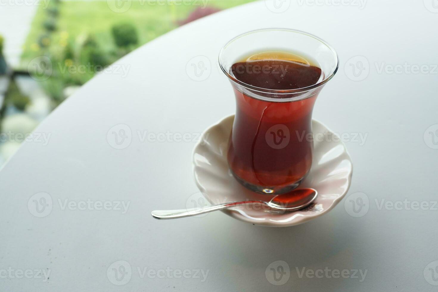 Traditional turkish tea on white table . photo