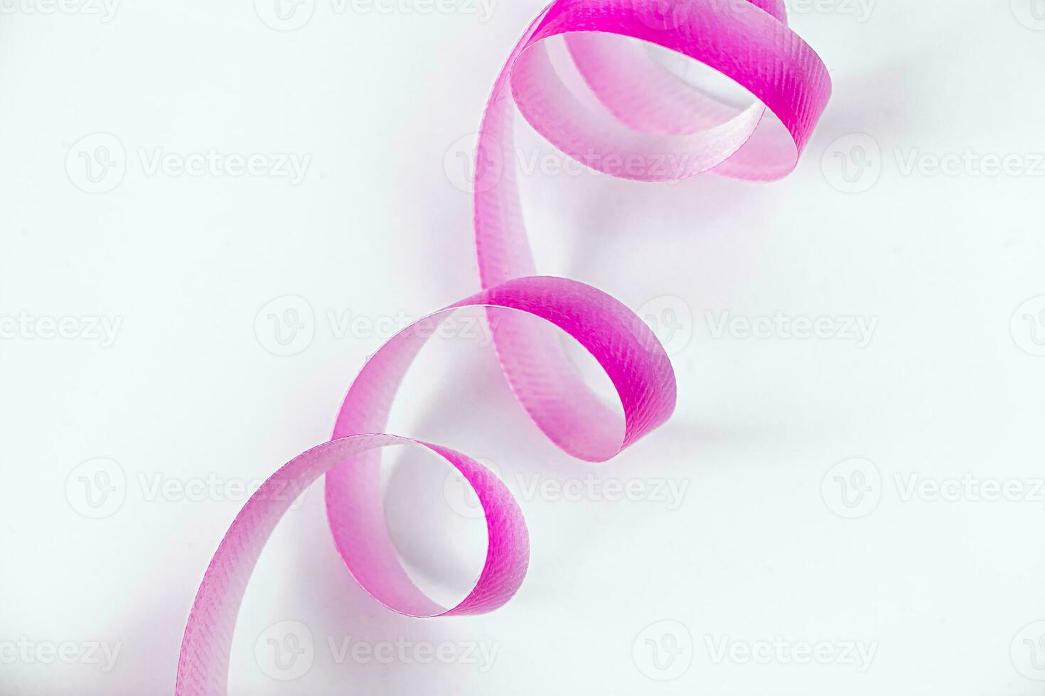 Pink ribbon for wrapping gifts on white background. photo