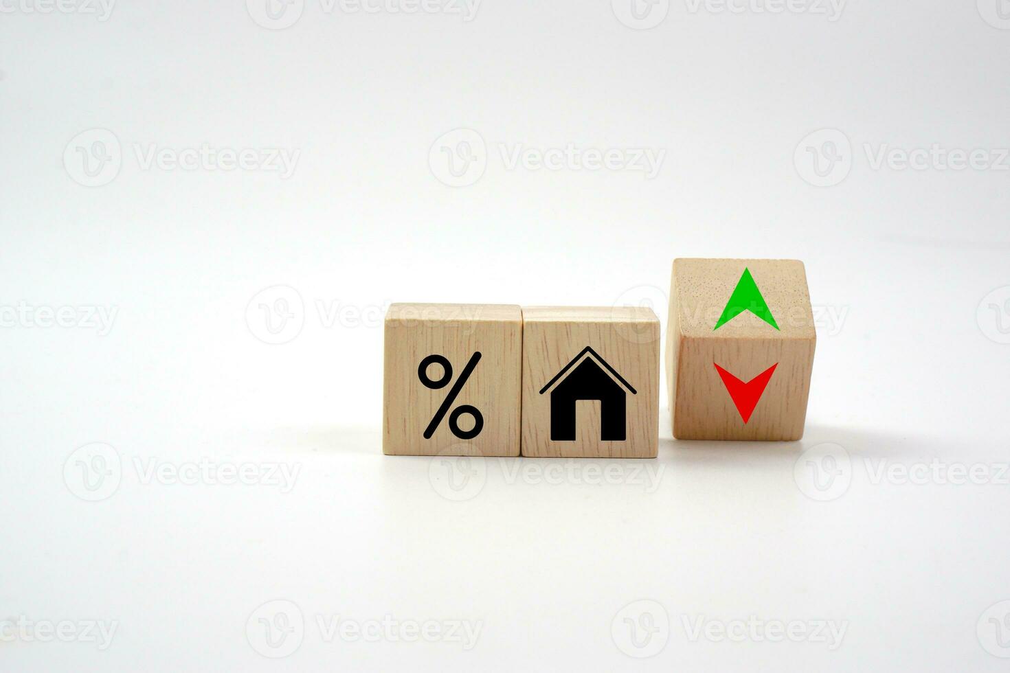 House icon with percentage on wooden block and up and down of arrow. Interest rate finance, real estate and house loan concept. photo