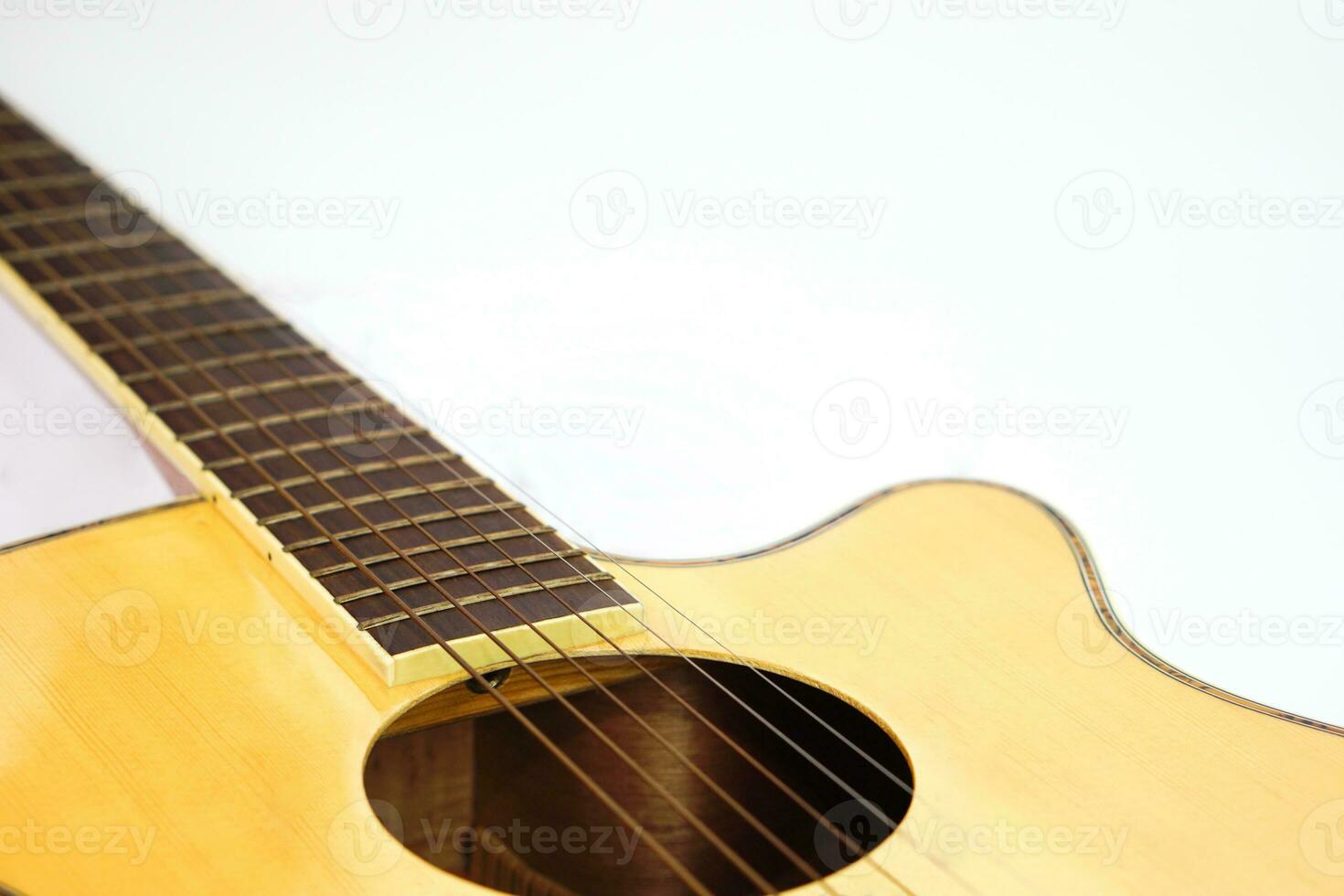 Selective focus, focus acoustic guitar strings on white background with copy space. Love, entertainment and music concept. photo