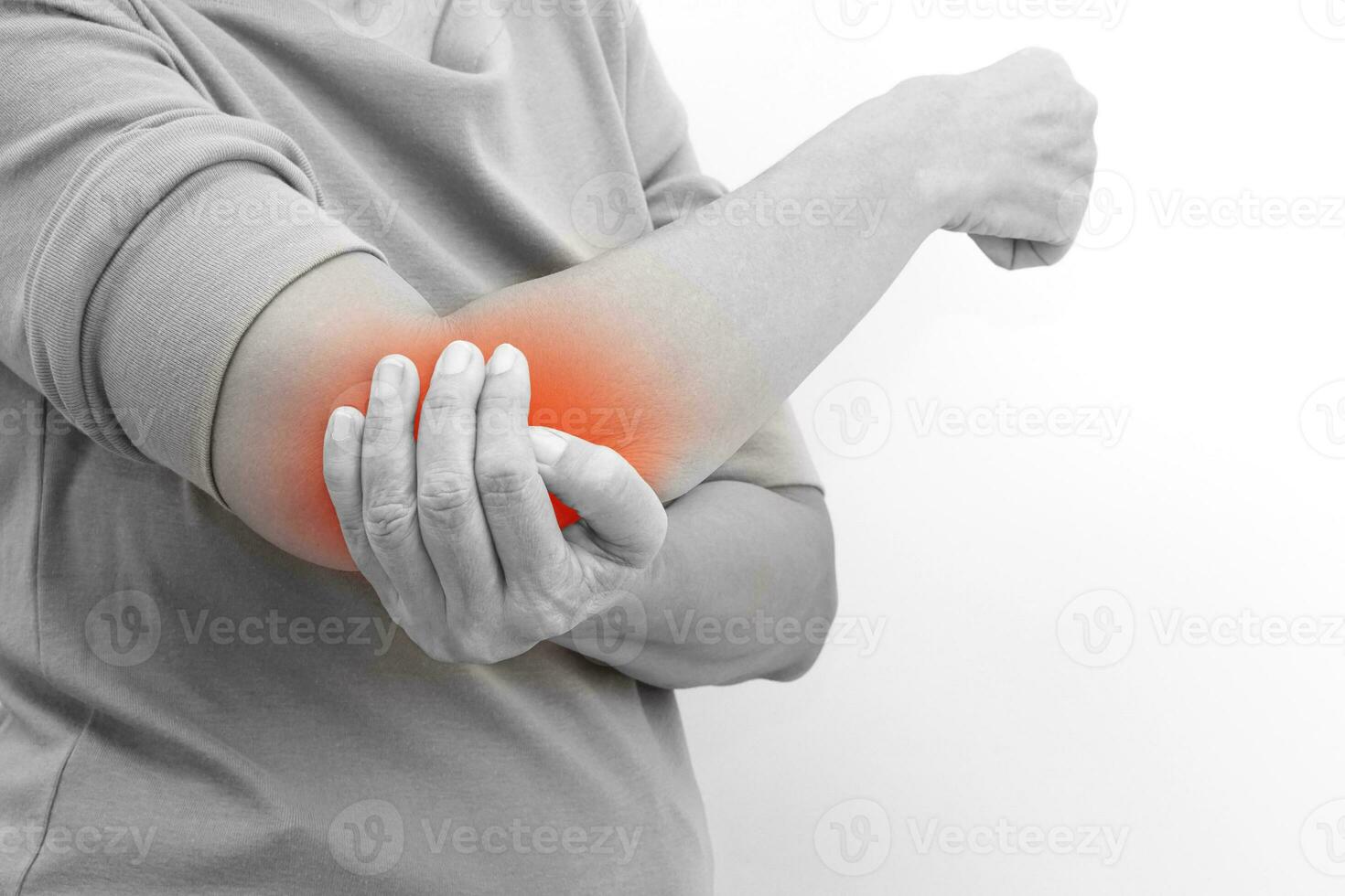 Healthcare and office syndrome concept, black and white photo of woman. She shows suffering from elbow pain.