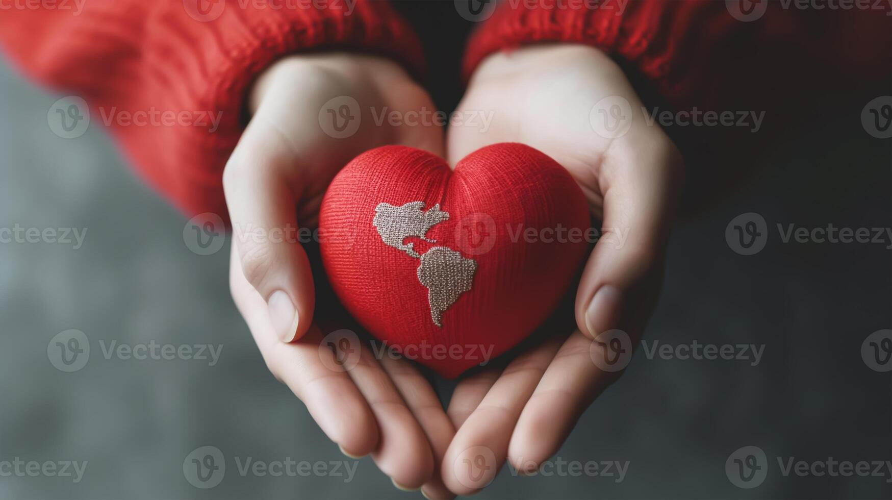 World heart day concept. Woman hands holding red heart with world map. photo
