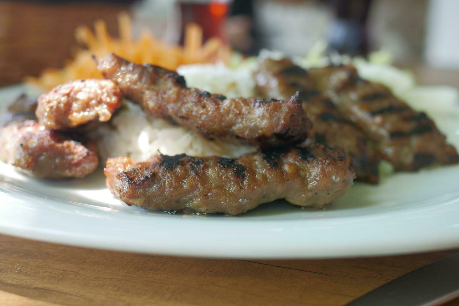 Kebab, traditional turkish meat food with salad on a plate . photo