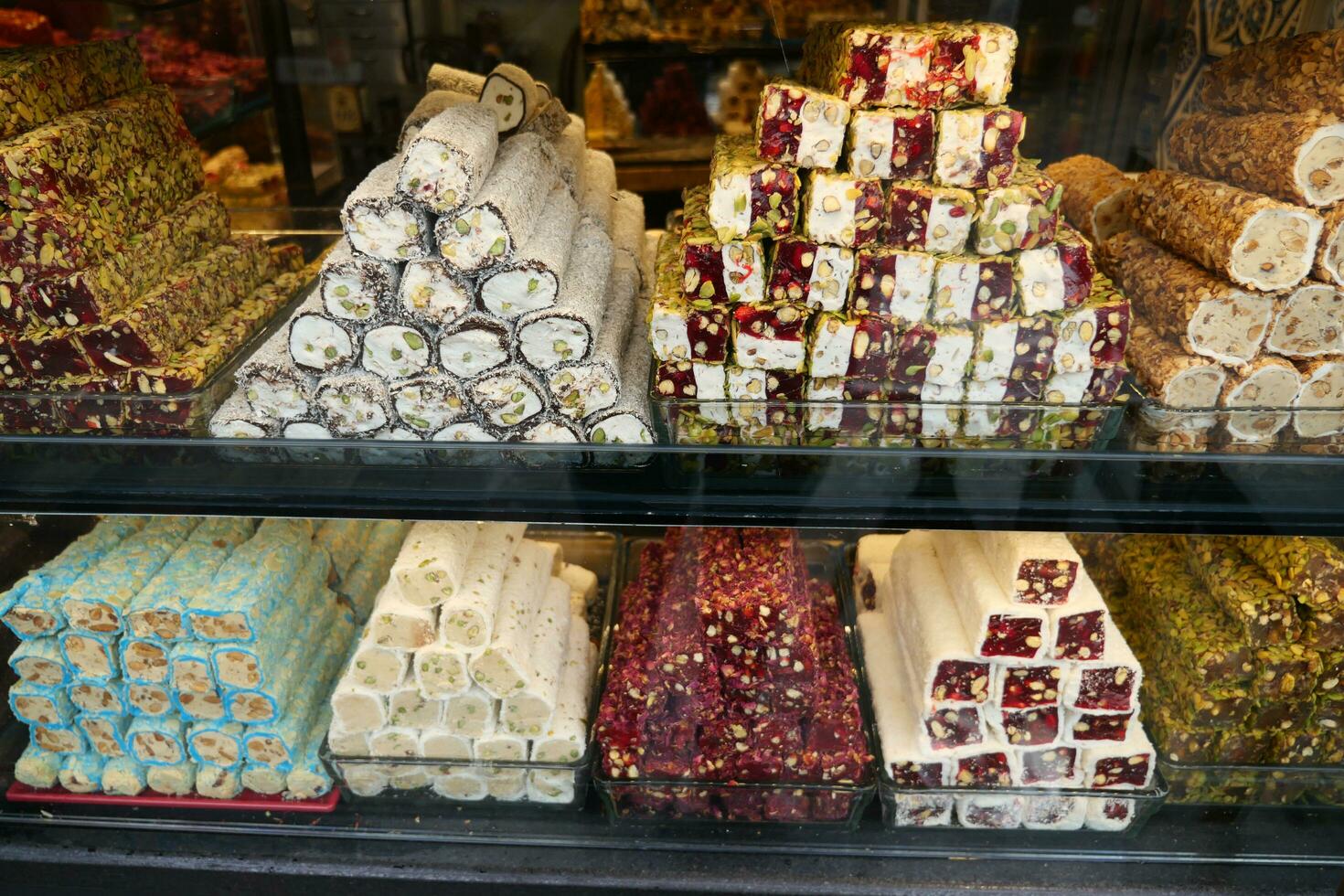 Turkish sweets of different taste and colour in the window shop. photo